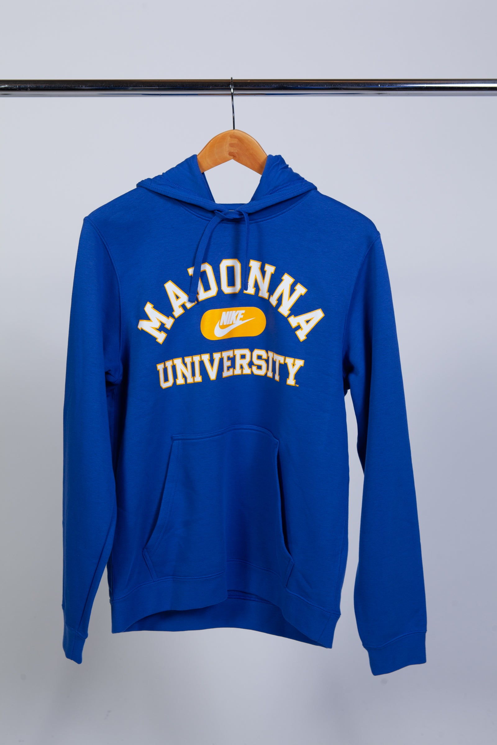 Blue hoodie with 'Madonna University' text on a hanger against a white background